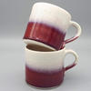 Red and white stoneware mugs