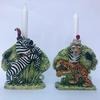 A pair of stoneware zebra and tiger candlesticks. Gold lustre. 17cm tall. £165.