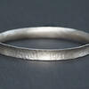 Sterling silver textured anticlastic bangle
