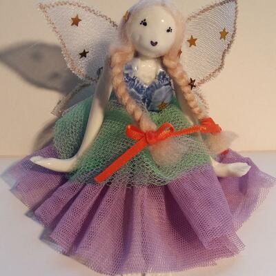 whimsical jointed porcelain fairy doll.