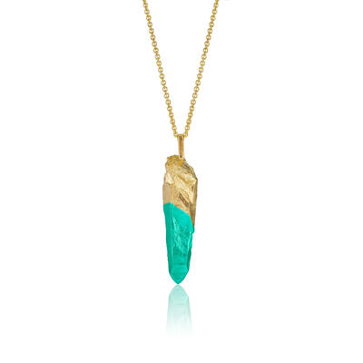 Large pendant in the form of a quartz crystal with gold plating a green tip