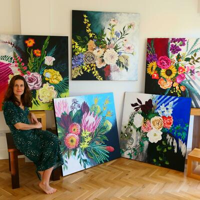 Alexandra Toyne with some of her paintings