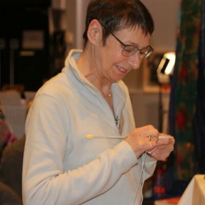 Elspeth Jane knitting at a Craft Fair