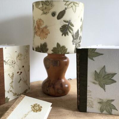 Handmade books and lampshades using my own individually designed fabrics, ecoprinted in this example.