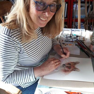 Janet working in her Garden Studio on a Watercolour wildlife portrait, ' Curious fox' 