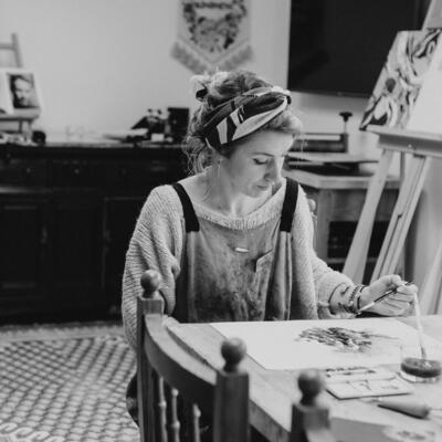 Photo of artist Kate Brandon working in her studio 
