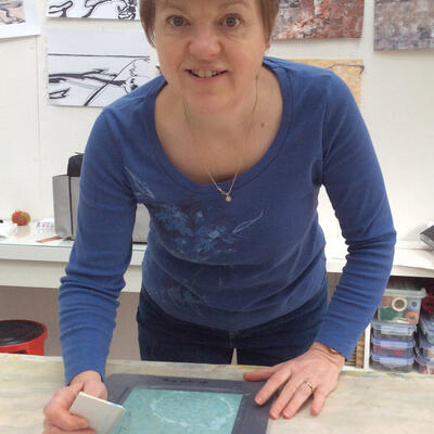 Artist Marian Hall screen printing in her home studio