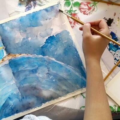 Artist painting with watercolours