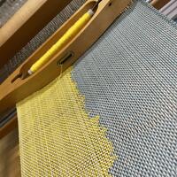 Weaving fine cotton on a table loom