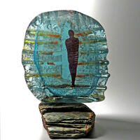 In the Shadows, sand cast glass, copper, slate. 23 x 18 cm
