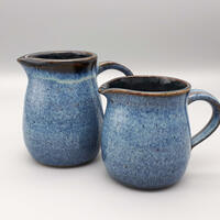 2 blue/black stoneware jugs