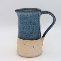 Simple stoneware jug in flecked clay