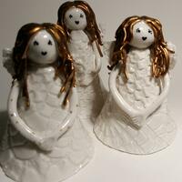 Christmas angels made from porcelain clay.