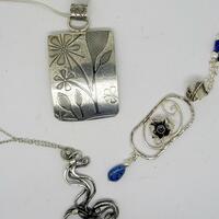 Sterling silver pendants.