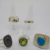 Sterling silver rings set with onyx, garnets and amethysts, dichroic glass and turquoise.