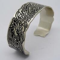 Sterling silver bangle with etched Celtic design.