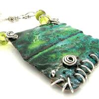 Enamel on copper pendant with silver an glass beads