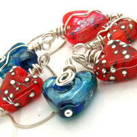 assortment of glass hearts with silver wire an chain.