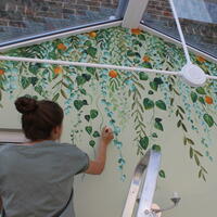 A orangery themed mural on a sage painted conservatory. Turns out this was a fab way to attract butterflies! Painted with Brewers wall paint sample pots. 