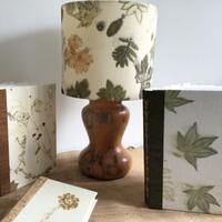Handmade books and lampshades using my own individually designed fabrics, ecoprinted in this example.