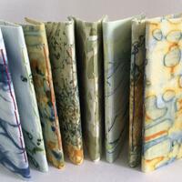Small notebooks made using hand printed fabrics