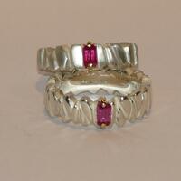 Ruby rings set in 18ct gold claws on cast silver rings