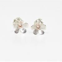 Silver forget-me-not, stud earrings with solid rose gold center.