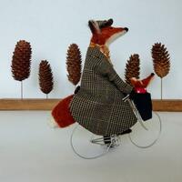 Mrs. Fox & junior enjoying a winter cycle ride!  Needlefelted wools with fabric embellishment.