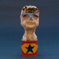 Figurehead: boy. Ceramic, wax, copper, brass (H) 15cm, £400