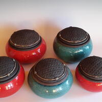Group of raku pots with textured lids