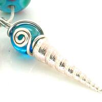 silver cast shell with lampwork bead