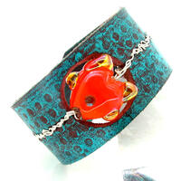 leather cuff with lampwork fish bead and silver wire