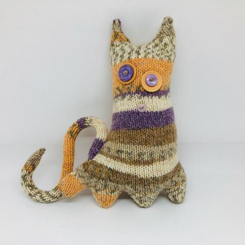 Curious Creature - Cynthia (a circumspect creature). Handknitted whimsy with polyester wadding, button features, wired tail.  Height: 9 ins; width: 9 ins; depth: 3 ins.  £25