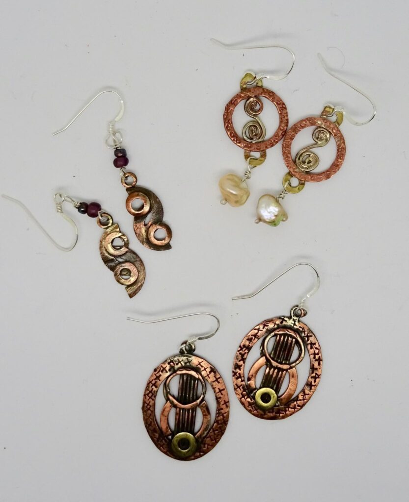 Copper and brass earrings made from washers., with sterling silver ear wires.