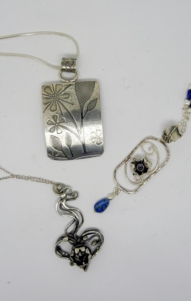 Sterling silver pendants.