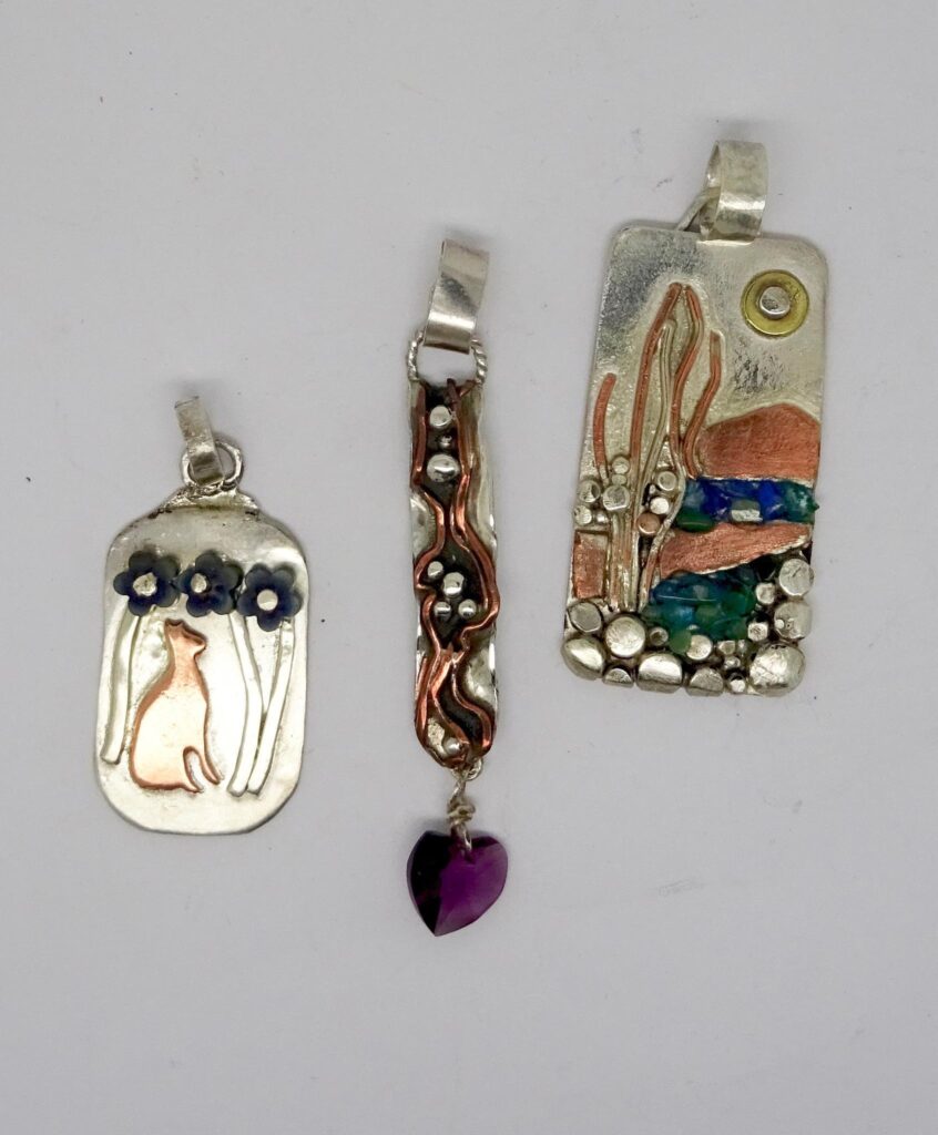  Mixed metal pendants. The cat and flowers. Copper and silver flow with Austrian crystal. Scenic pendant .