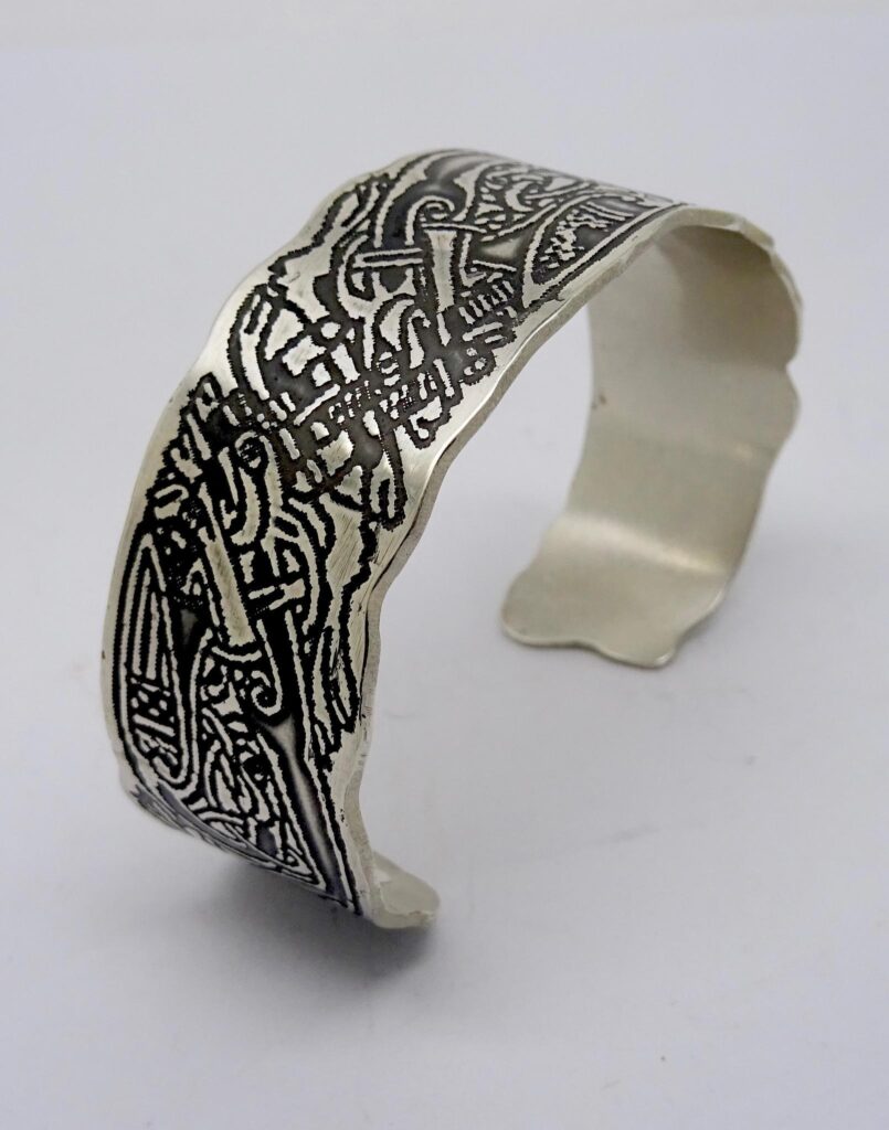 Sterling silver bangle with etched Celtic design.
