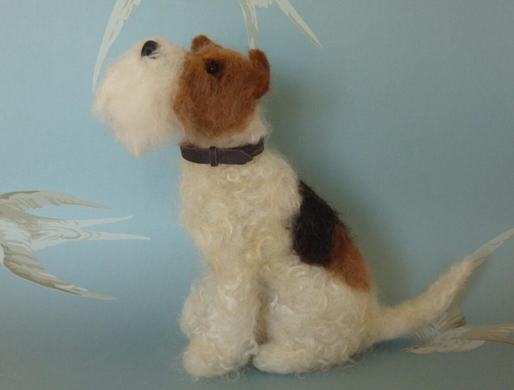 "Is it dinner time yet?"  Wire Fox Terrier needlefelted with Shetland, Merino and Wensleydale wools.