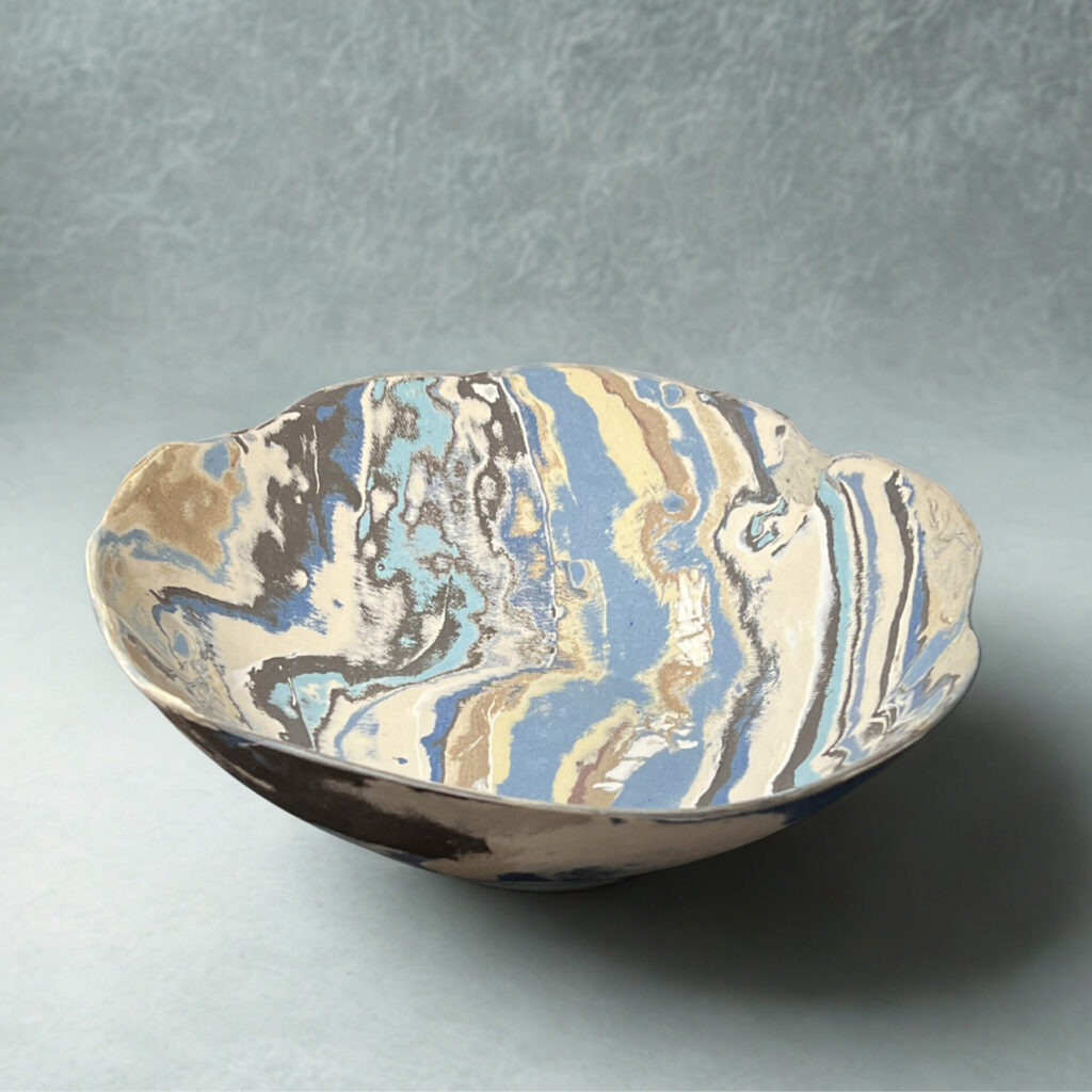 ceramic bowl coloured by layers of clay