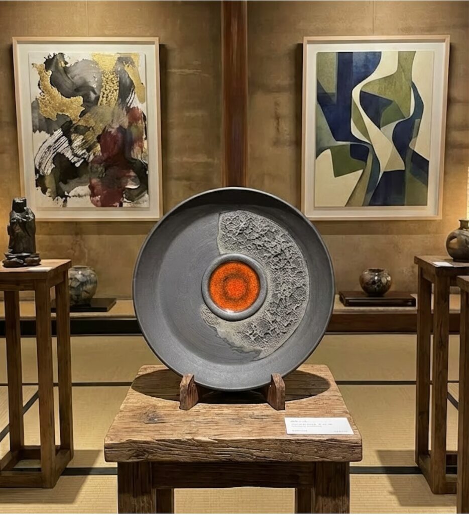 Enso style black plate artwork in gallery