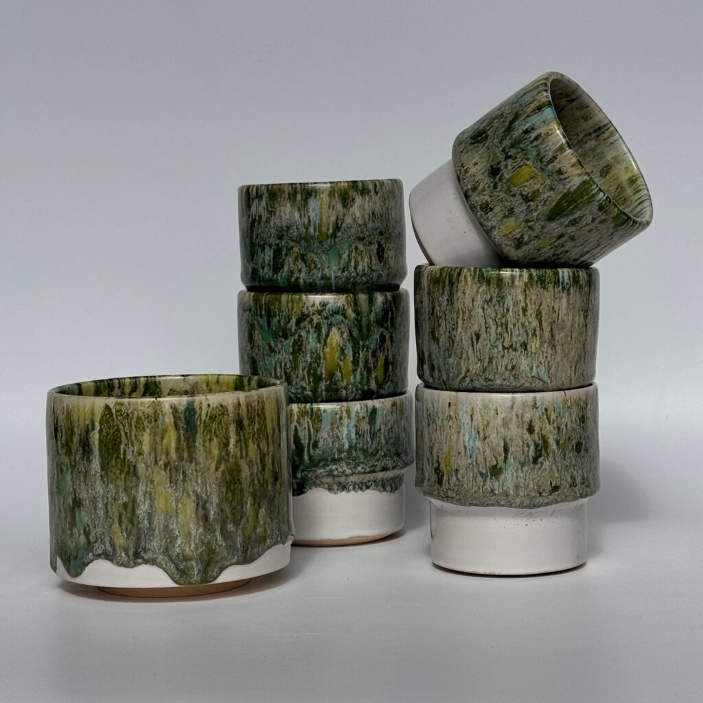 Wheel-thrown stackable cups with drip glaze